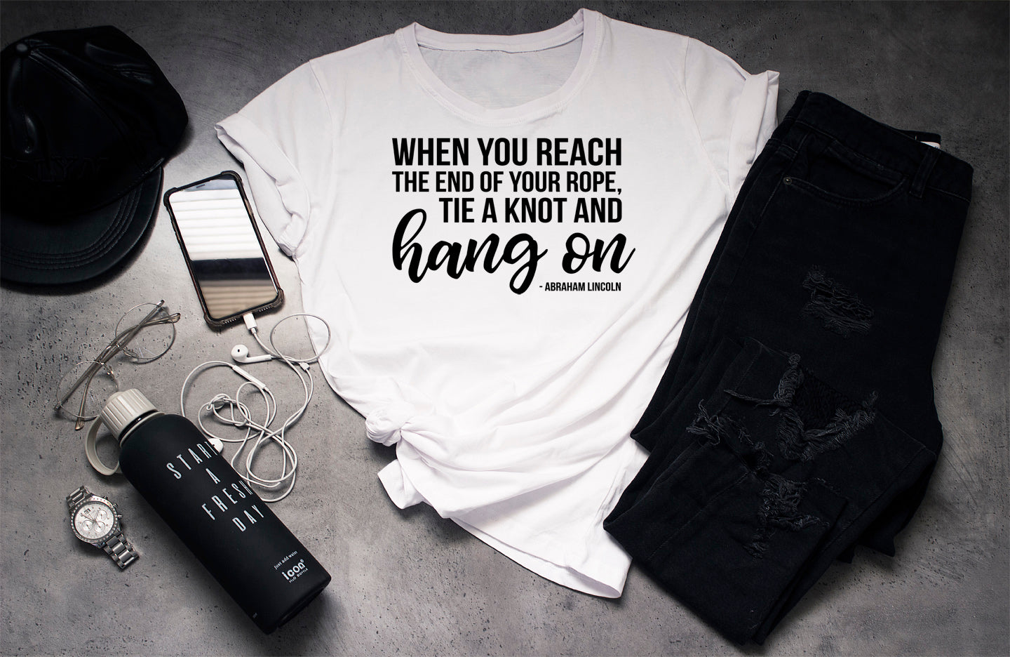 WHEN YOU REACH THE END OF YOUR ROPE, TIE A KNOT AND HANG ON - ABRAHAM LINCOLN